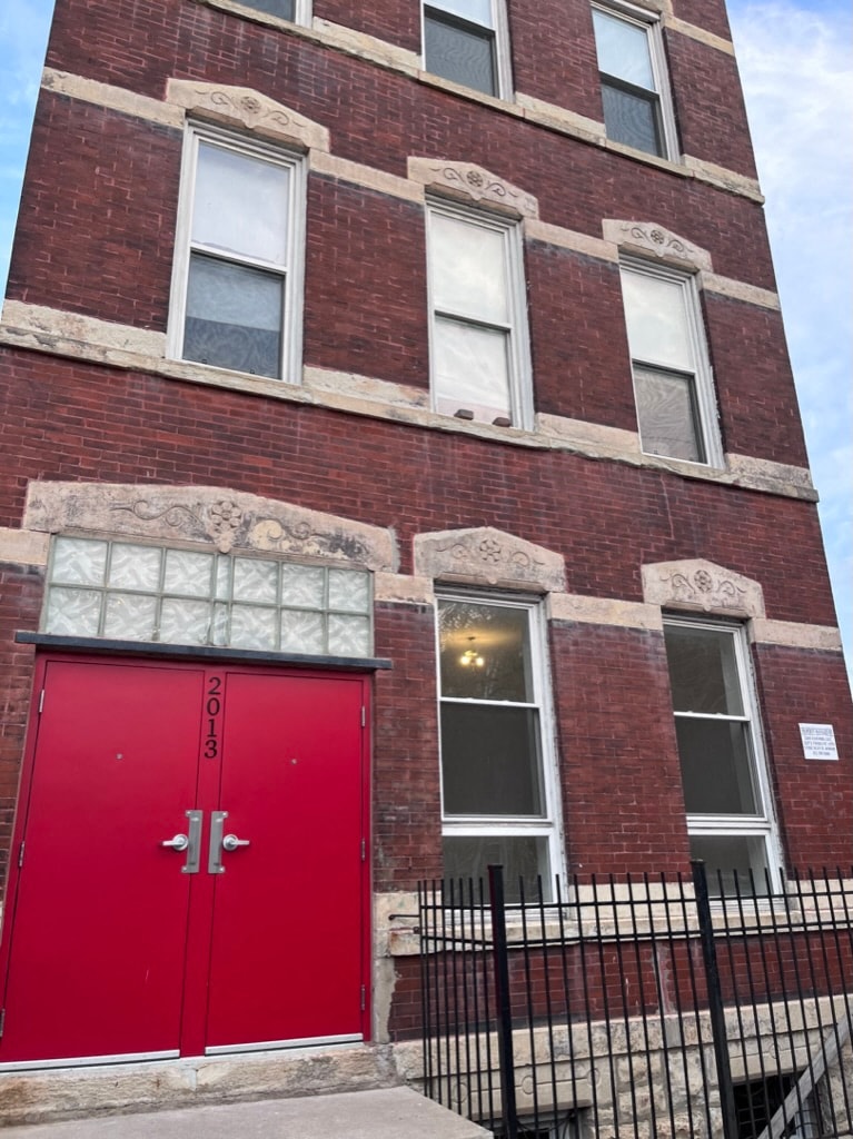 A red door with the numbers 2013 on it.