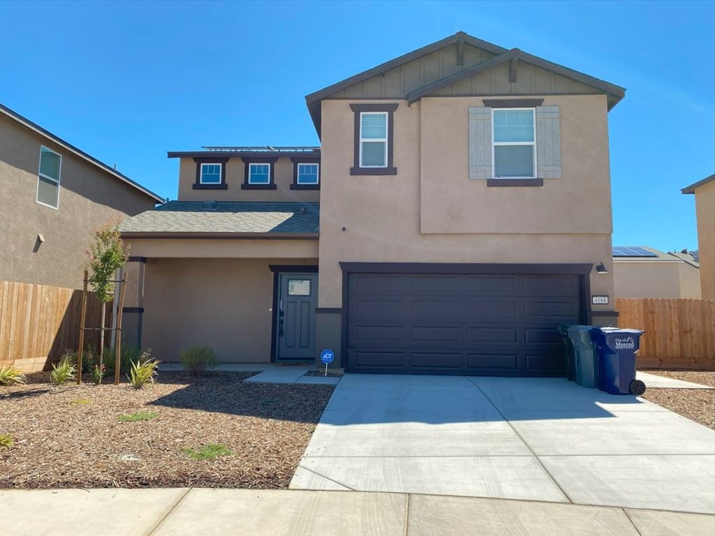 a house with a driveway and a garage door