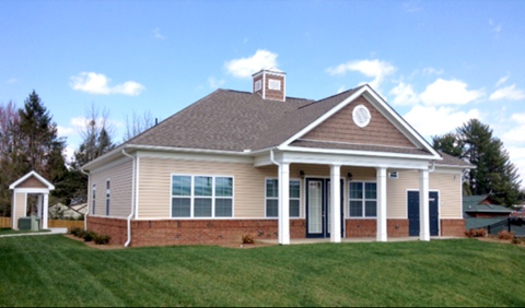 a house with a lawn in front of it