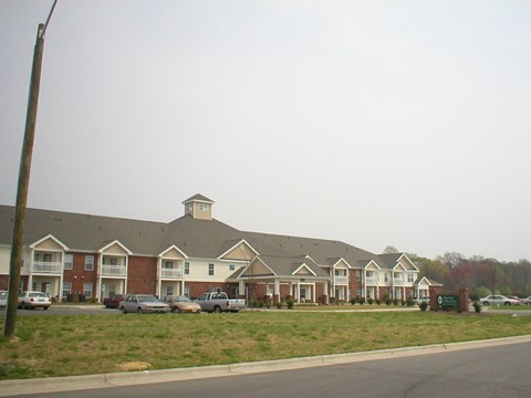 a row of houses on the side of a street