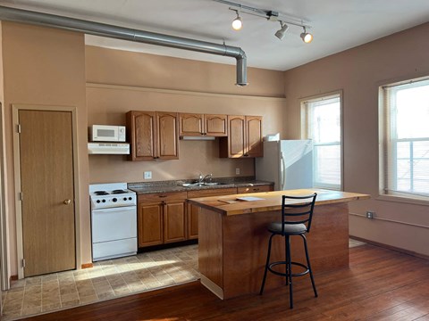 a kitchen with a counter top and a sink