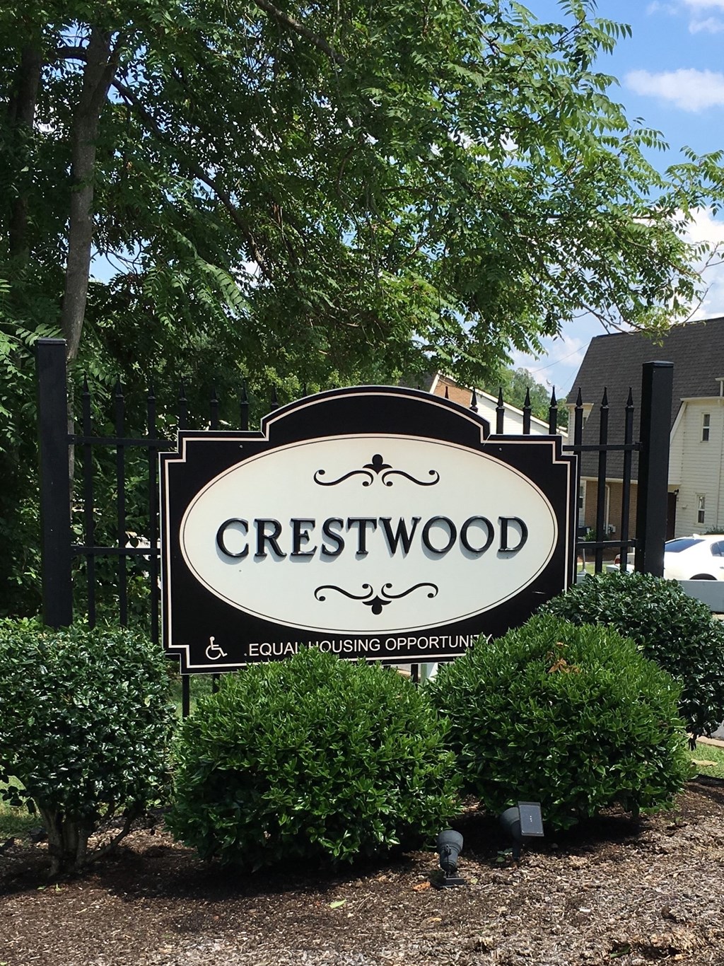 a sign for the cresswood sign in front of a gate