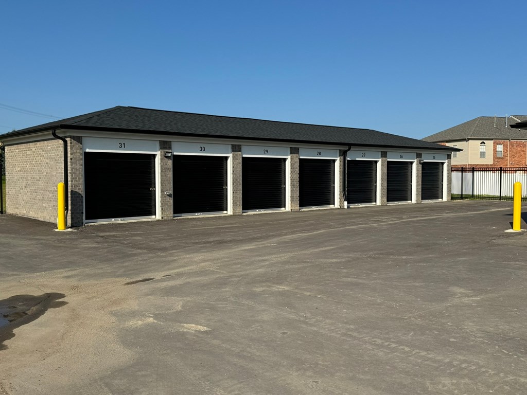 a row of garage doors in a parking lot