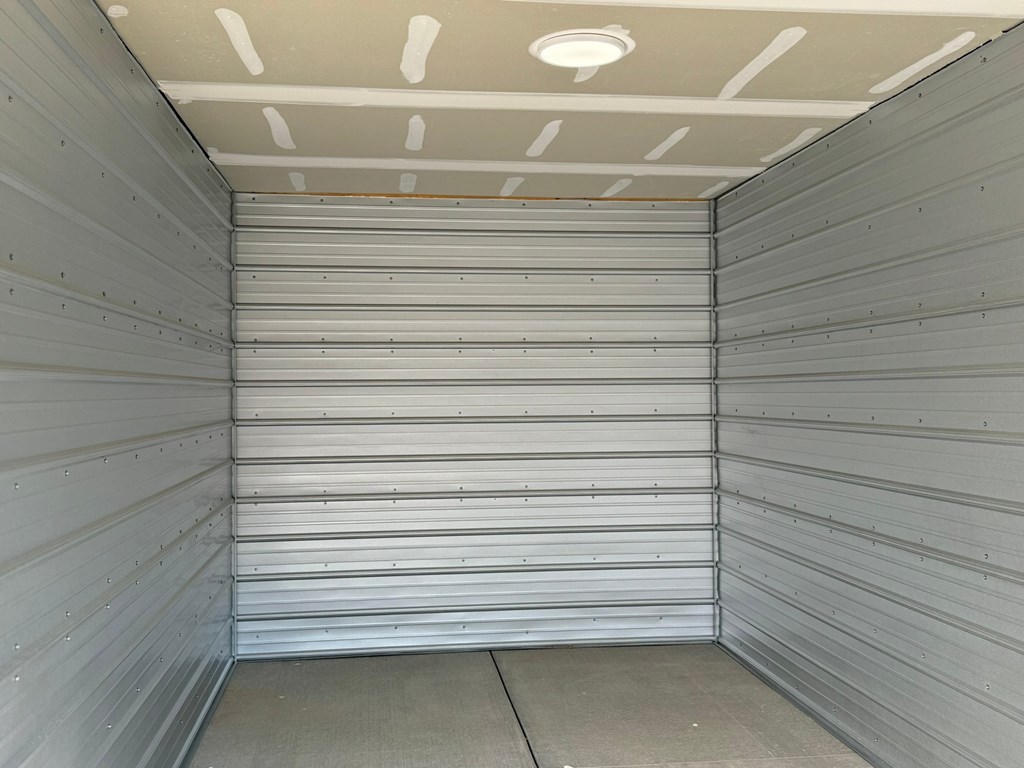 the inside of a storage room with white walls and a white ceiling