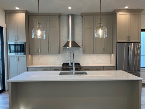 a kitchen with a sink and a counter top