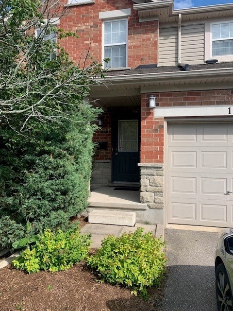 a house with a white door and a white garage door