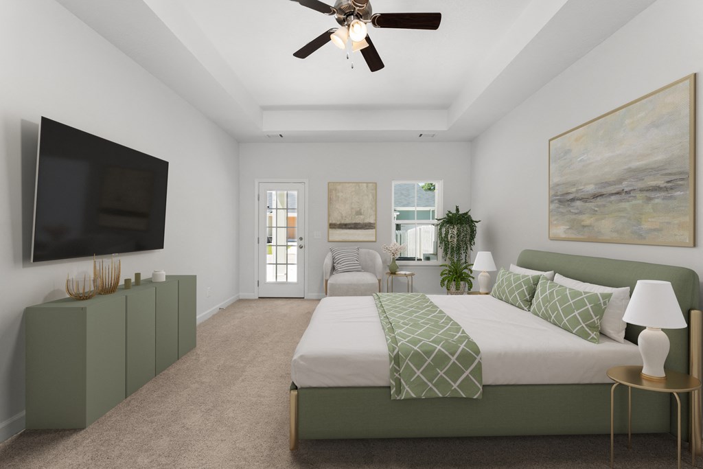 a bedroom with a large bed and a ceiling fan