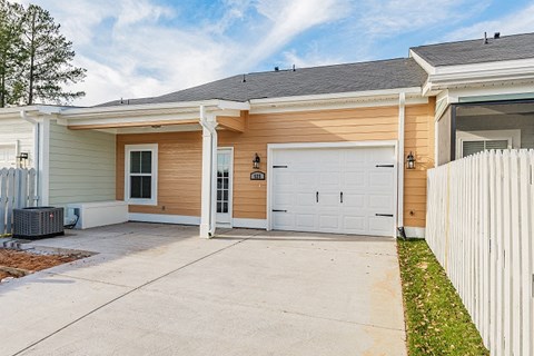 a house with a white garage door and a driveway