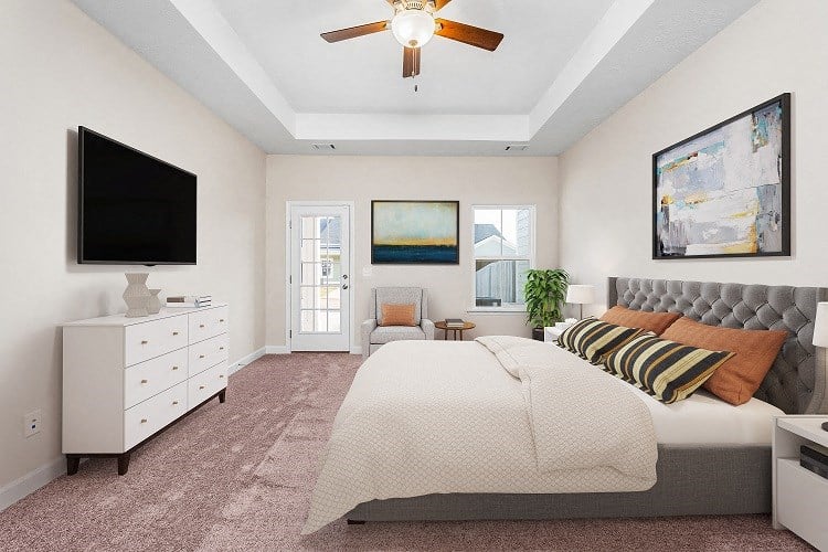 a bedroom with a bed and a ceiling fan