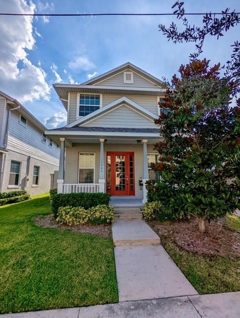 A house with a red door and a small porch.