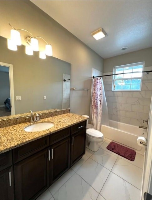 A bathroom with a sink, toilet, and shower.