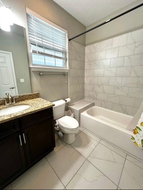 A bathroom with a toilet, sink, and bathtub.