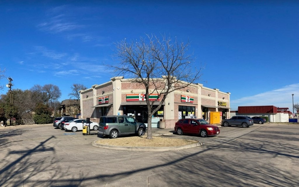 a building with cars parked in front of it