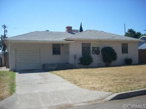 A house with a grey roof and a grey garage door.