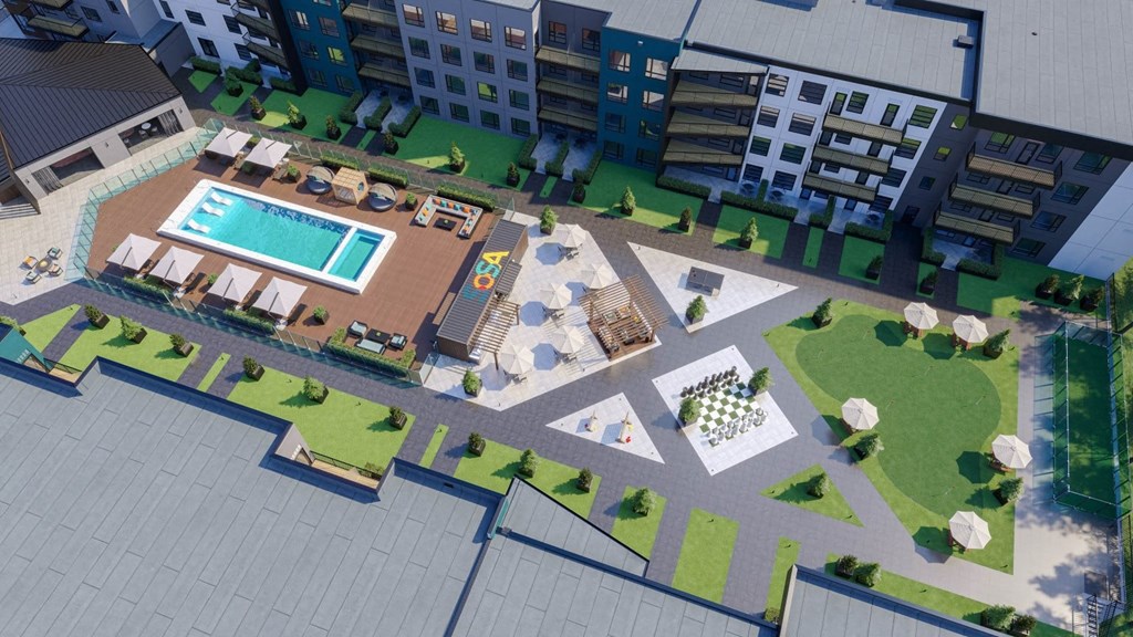 an aerial view of an apartment complex with a swimming pool