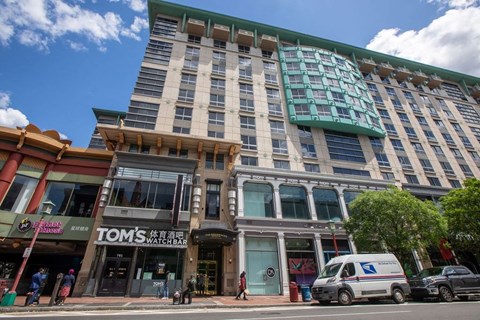 a large building on the corner of a city street
