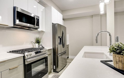 a kitchen with stainless steel appliances and a sink