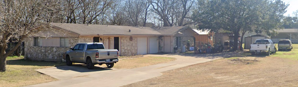 a house with a truck parked outside of it