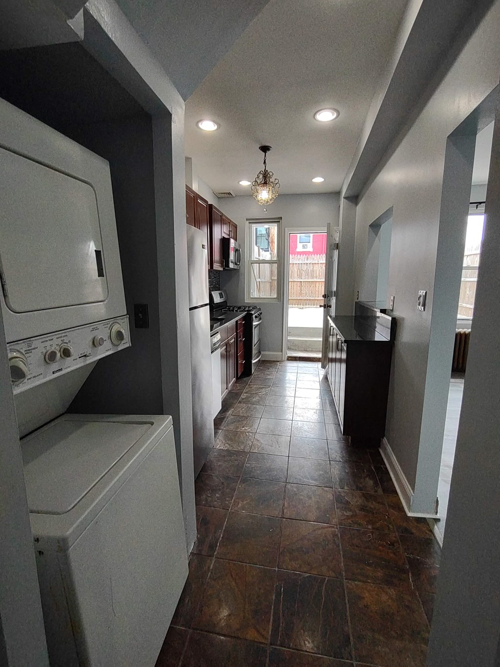 a kitchen with a washer and a dryer in it