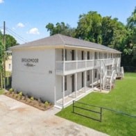 A white building with the word "BROOKS" on the side.