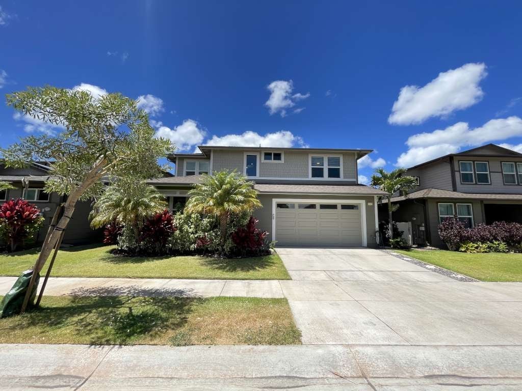 a house with a driveway and a garage door