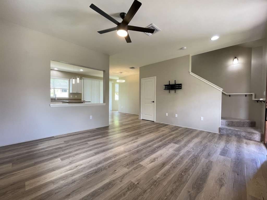 the living room is open to the dining room and kitchen
