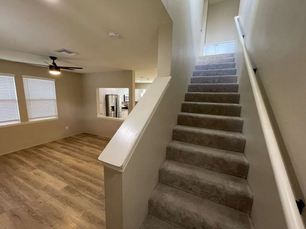 a staircase in a house with a carpeted floor