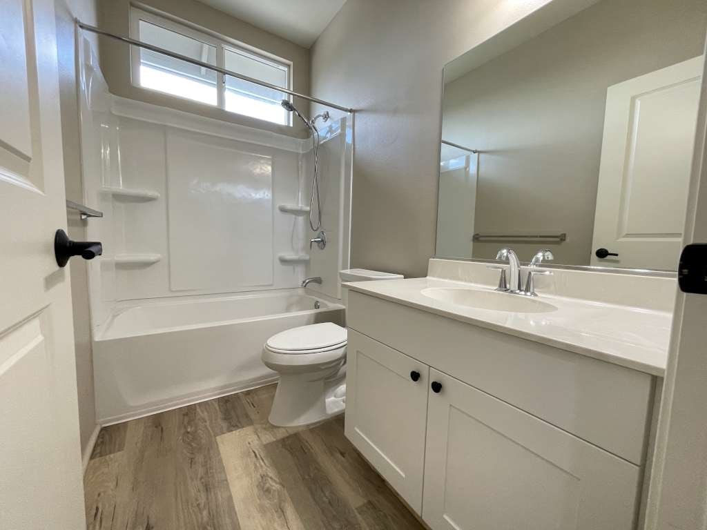 a bathroom with a sink toilet and a bath tub