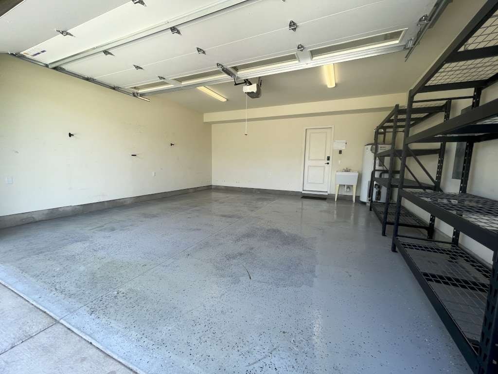 a large empty room with stairs and a concrete floor