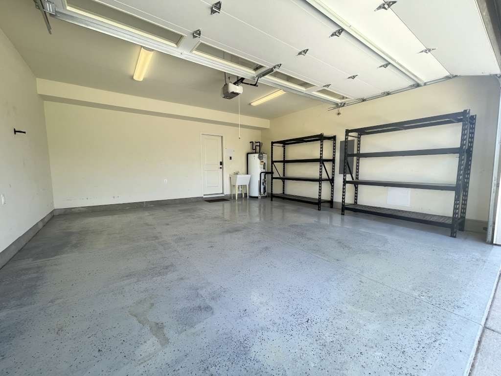 the inside of a garage with a concrete floor