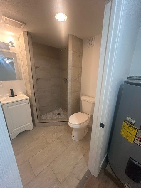 A bathroom with a toilet, sink, and shower.