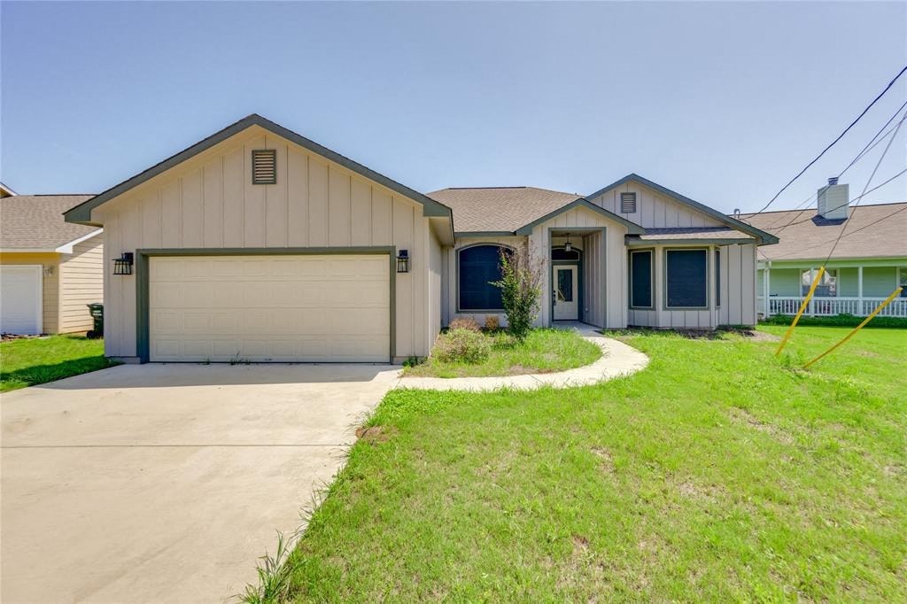 a house with a driveway and a garage door
