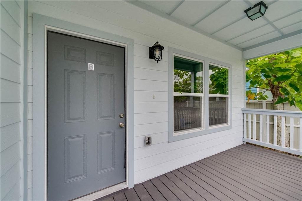 the front door of a house with a porch