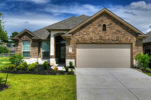 a house with a garage door in front of it