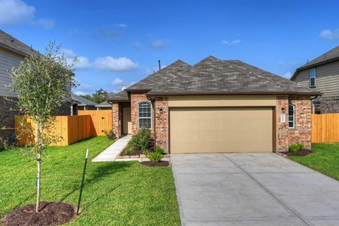 a house with a driveway and a garage door
