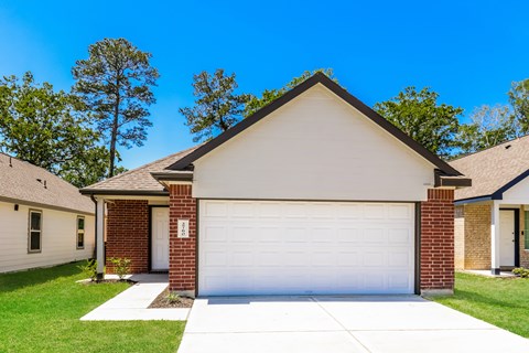 a white garage door in front of a house
