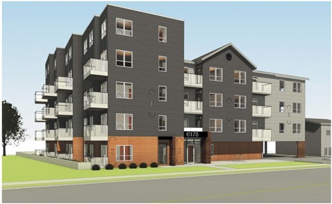 A modern apartment building with balconies and a street view.