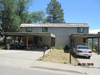 a house with a car parked in front of it
