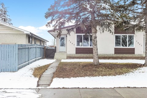 the front of the house in the snow