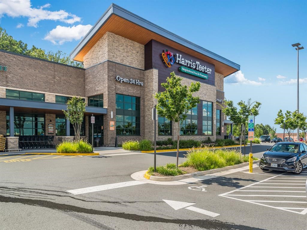 the front of a health center with a car parked outside