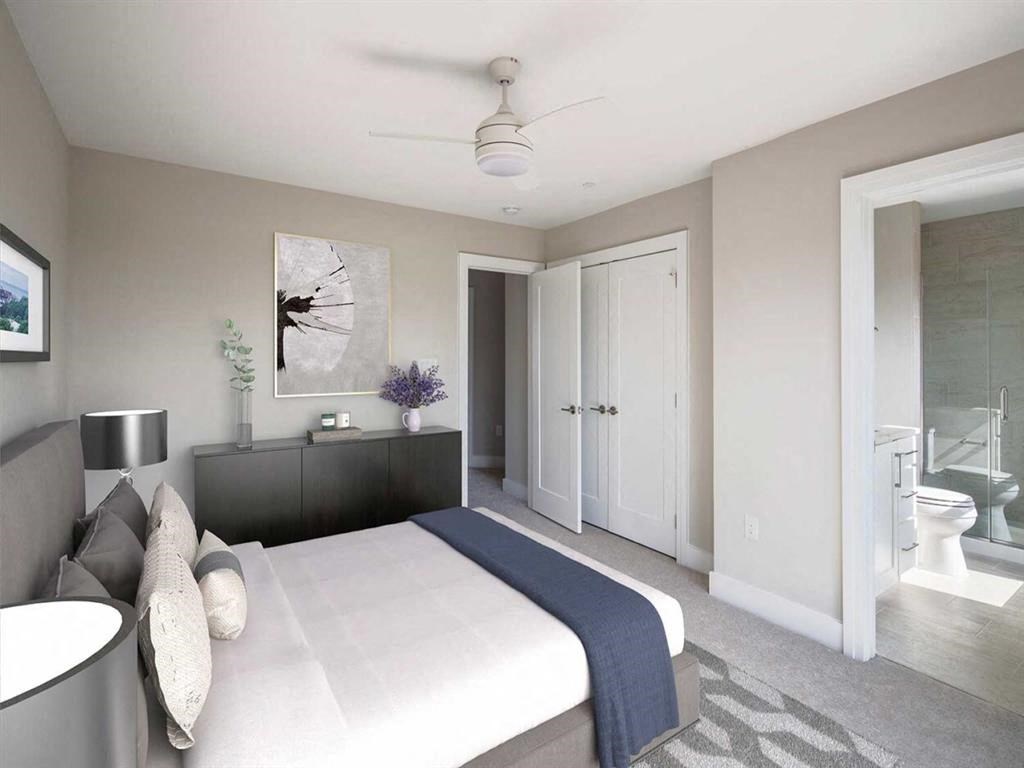 a bedroom with a bed and a bathroom with a toilet and a sink