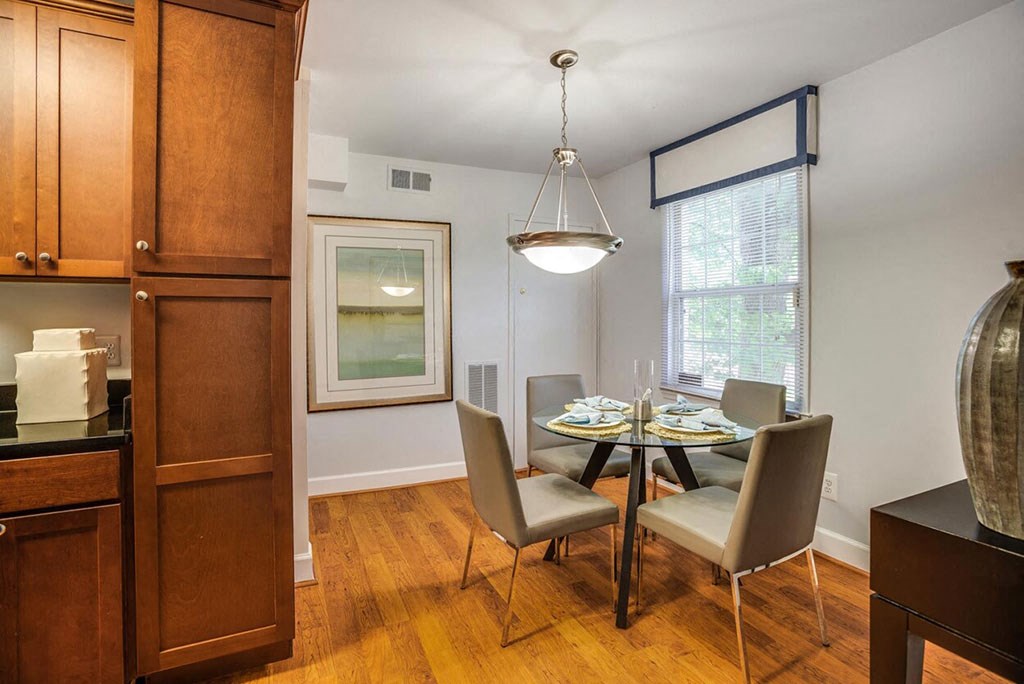 a dining room with a table and chairs