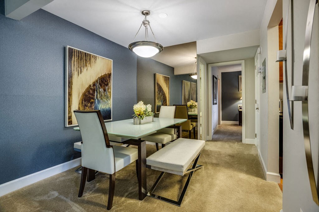 a dining room with a table and chairs