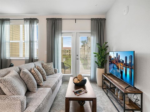 a living room with a couch and a tv