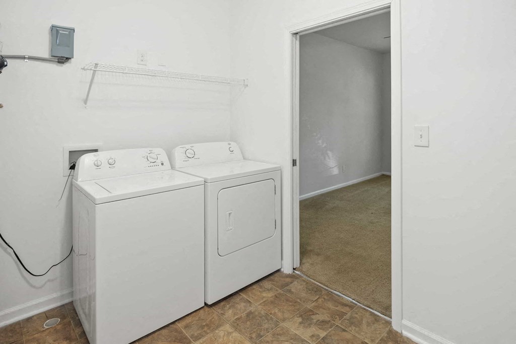 A laundry room with a washer and dryer.
