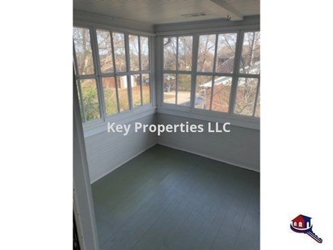 A room with Key Properties LLC written on the wall.