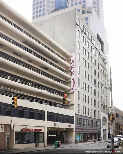 a large building on the corner of a city street