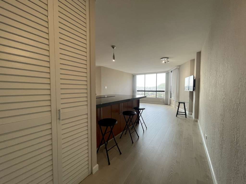 A room with a table and chairs in it.