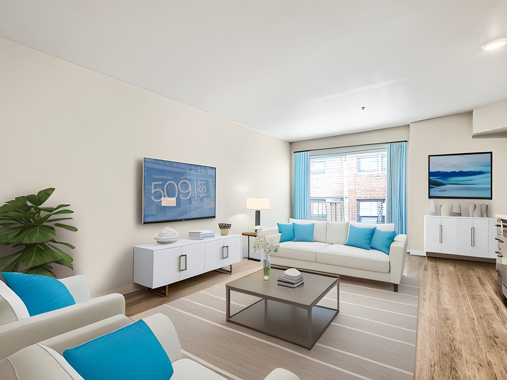 a living room with blue and white furniture and a window