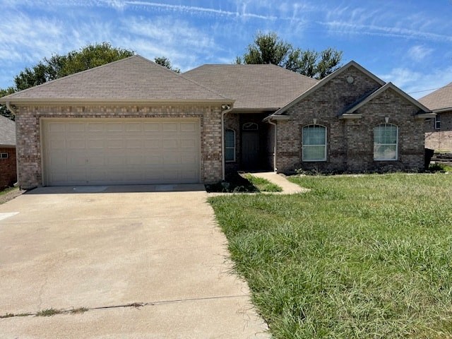a house with a driveway and a garage door